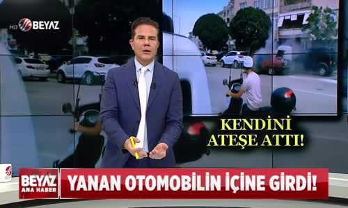YANAN OTOMOBİLİN İÇİNE GİRDİ!